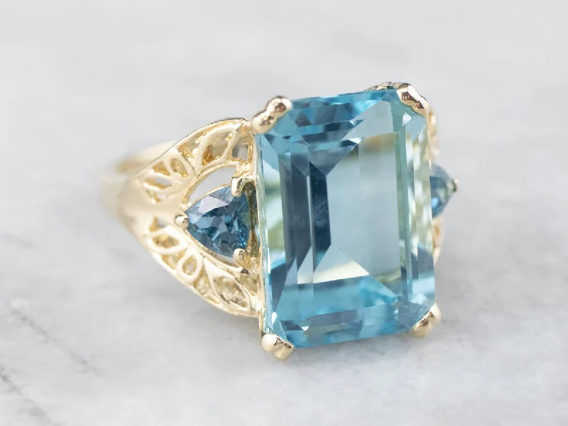 Three Stone Blue Topaz Gold Cocktail Ring